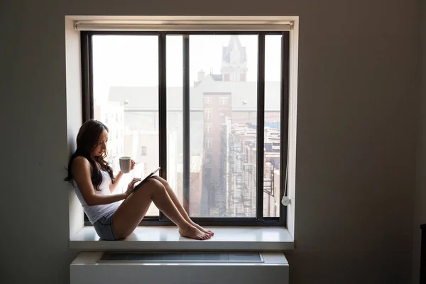 Mid Adult Woman Using Tablet Windowsill — Stock Photo, Image