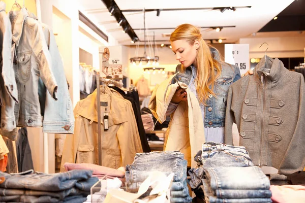 Choosing jackets in clothes shop