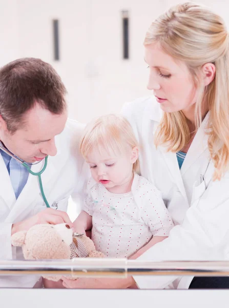 Two Medics Tending Child — kuvapankkivalokuva