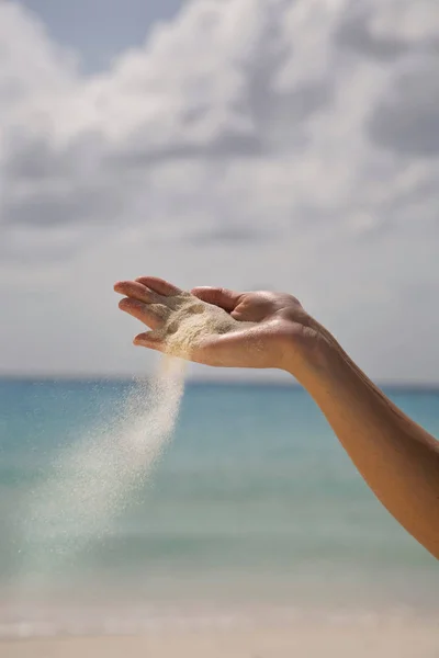 Sand Falling from Woman\'s Hand