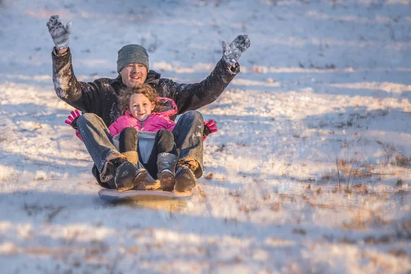 Portrait Smiling Father Daughter Riding Sledge Downhill Snow — Stock Photo, Image