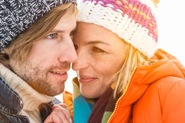 Portrait of couple wearing knit hats