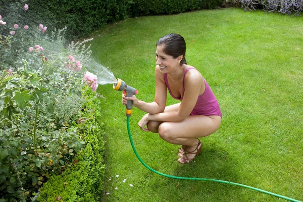 Woman Swimsuit Watering Plants — Stock Photo, Image