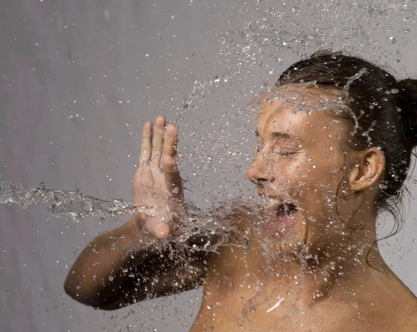 Woman splashed with water