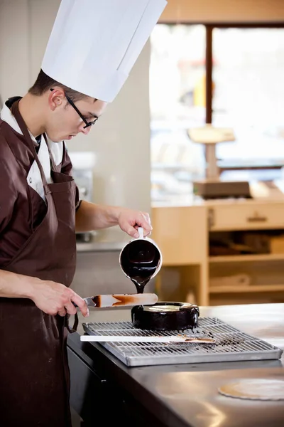 Baker Pouring Chocolate Kitchen — Stock Photo, Image