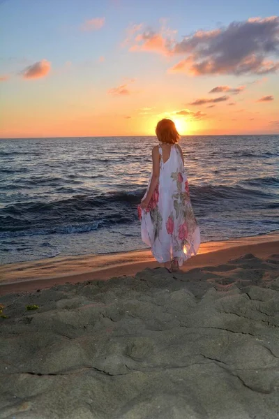 Girl Long Dress Standing Sea Beach Sunset Facing Sun Head — Stock Photo, Image