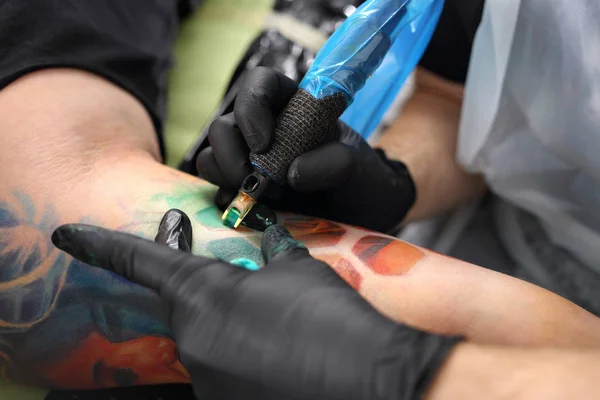 tattoo artist tattooing color tattoo