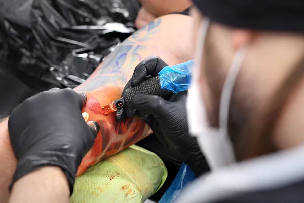 tattoo artist tattooing color tattoo