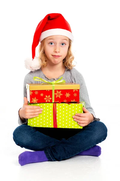 Klein Grappig Meisje Met Santa Claus Cap Zoek Verbaasd — Stockfoto