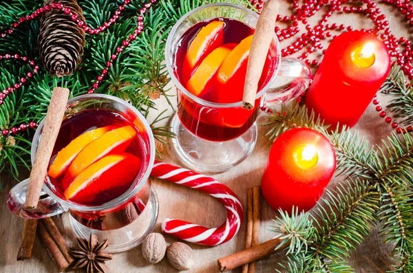 Two Glasses Mulled Wine Red Candles Spices Christmas Tree Branches Royalty Free Stock Images