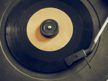 Vintage looking Vinyl record on a turntable record player, single 45rpm disc clipart