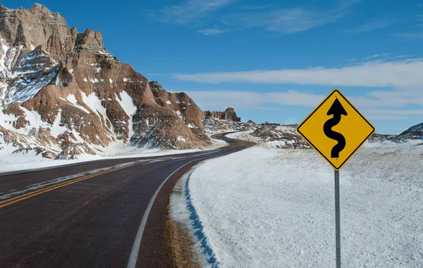 Sign Warns Twisting Road Ahead Winter Day Badlands National Park — Stock Photo, Image