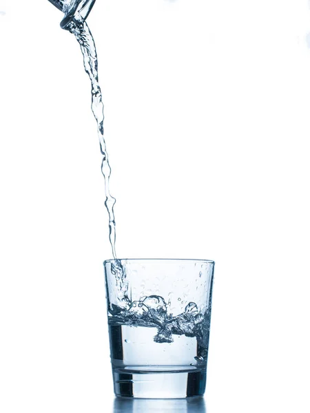 Agua Vertida Vidrio Aislado Sobre Fondo Blanco —  Fotos de Stock