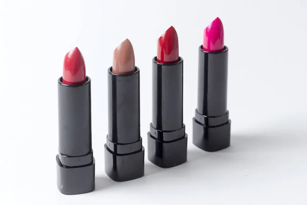 Four Different Colored Lipsticks White Background — Stock Photo, Image