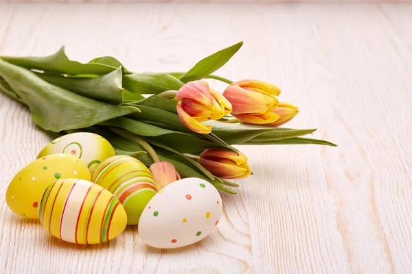 Colored Easter Eggs Spring Tulips Flowers Wooden Background Greeting Card — Stockfoto