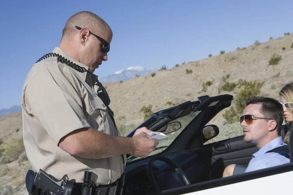 Mature Traffic Cop Checking Man License Royalty Free Stock Photos