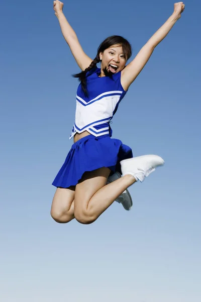 Full Length Excited Young Cheerleader Jumping Sky — Stock Photo, Image