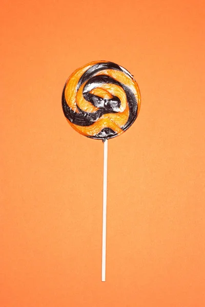 Black Orange Lollypop Orange Background — Stock Photo, Image