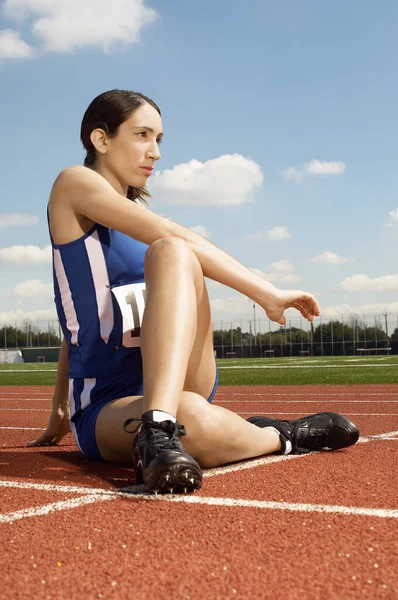 Full Length Athlete Woman Stretching Race Track — Stockfoto