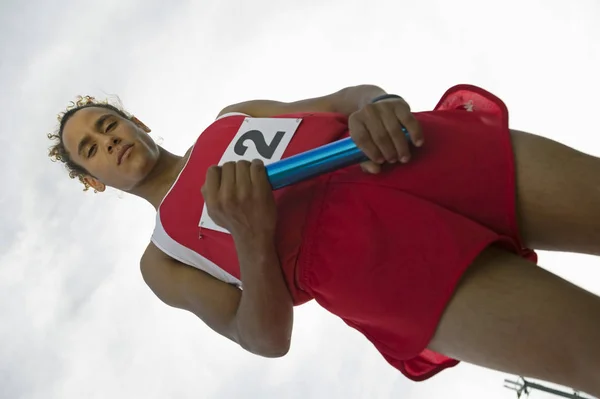 Tilt Image Confident Male Athlete Holding Baton Cloudy Sky — Stock Photo, Image