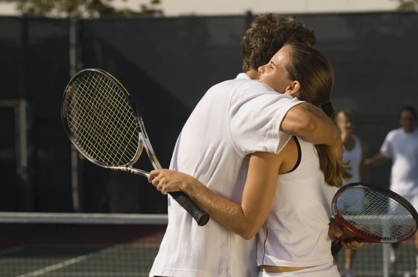 Tennis Players Embracing Winning Match Partners Standing Background — Stock Photo, Image