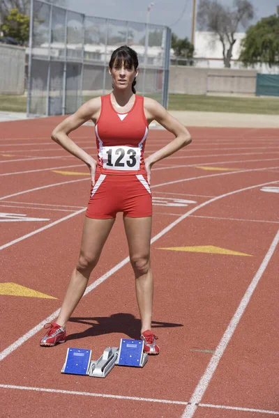 Full Length Confident Female Athlete Starting Block Race Track — Stock Photo, Image