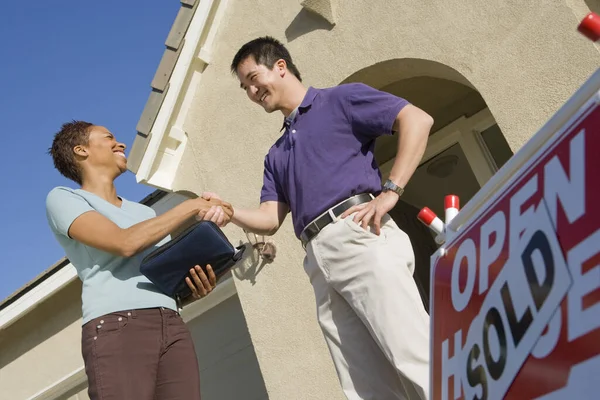 Low Angle View Female Estate Agent Shaking Hands Man His — Stok fotoğraf