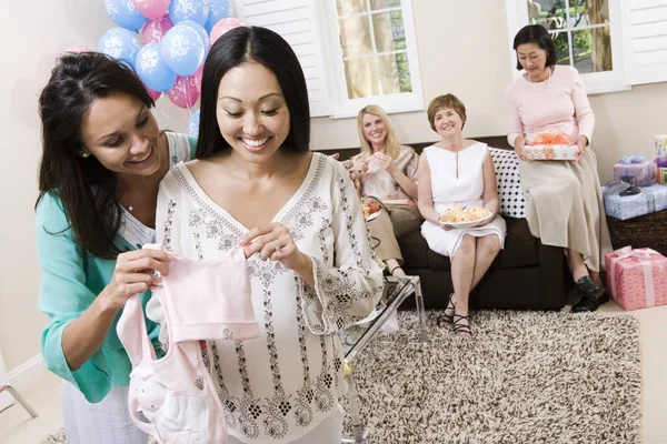 Happy Pregnant Woman Friend Holding Baby Clothes Baby Shower Stock Image