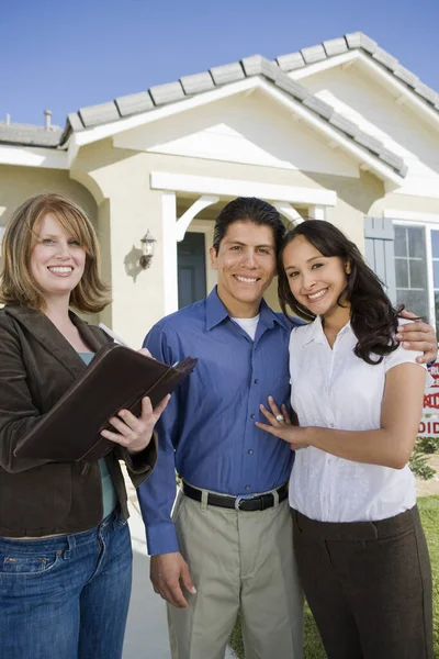 Portrait Loving Hispanic Couple Female Real Estate Agent Stock Image