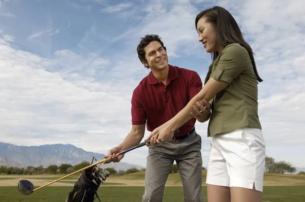 Happy Mature Man Teaching Woman Play Golf — Stock Photo, Image