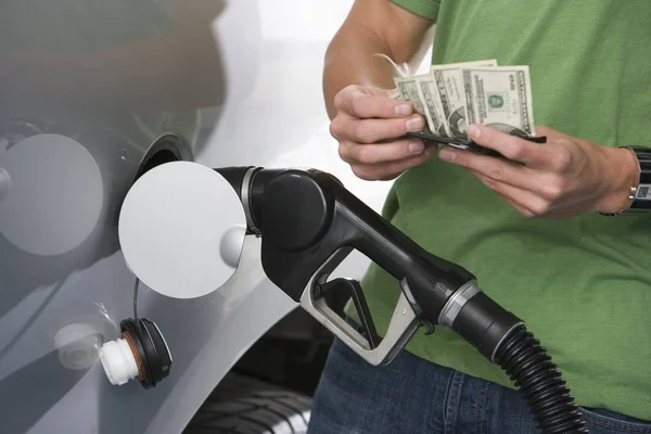 Mid Section Young Man Counting Money While Refueling Car — Stock Photo, Image