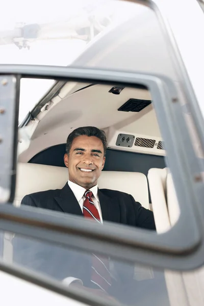 Portrait Happy Mature Businessman Travelling Helicopter — Stock Photo, Image