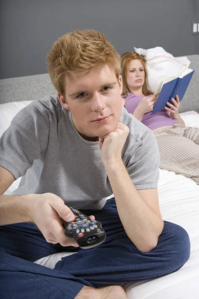 Young Man Watching Woman Reading Novel Bedroom — Stock Photo, Image