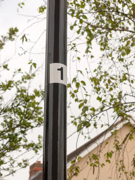 Black Pole Leading White Sticker Number Clear Directions Numbering One — Stock Photo, Image