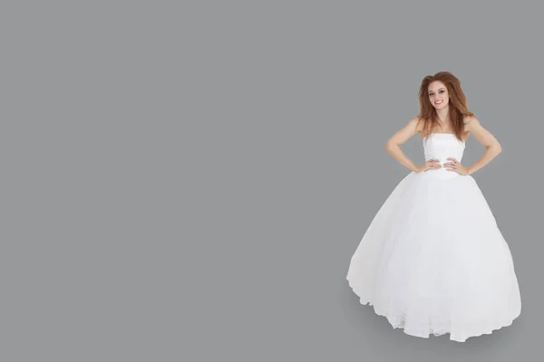 Portrait Happy Brunette Wedding Dress Hands Hips Standing Gray Background — Stock Photo, Image