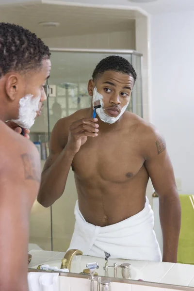 Young African American Man Shaving Front Bathroom Mirror — Stock Photo, Image