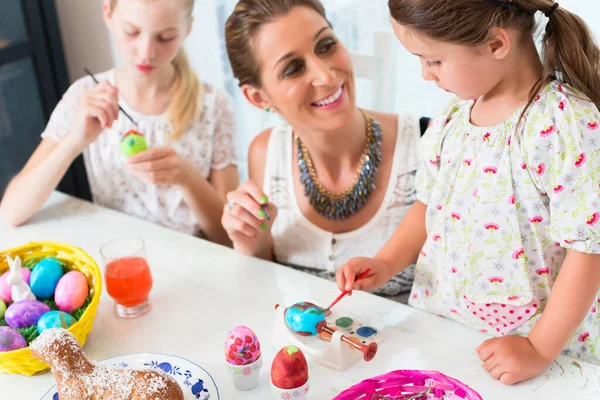Family Having Fun Coloring Easter Eggs — Stock Photo, Image