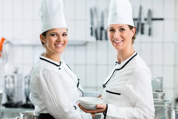 Two Female Chefs Gastronomic Kitchen Wearing White Cooking Uniforms — Stock Photo, Image