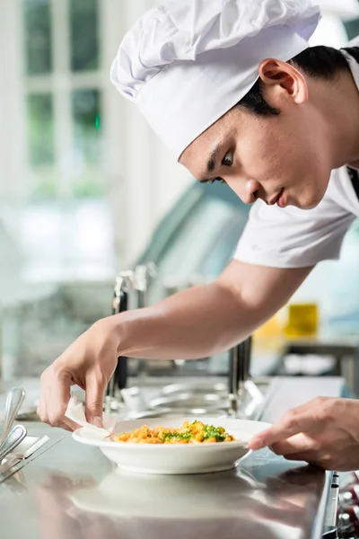 Handsome Young Asian Chef Plating Food Commercial Kitchen Carefully Wiping — Stock Photo, Image