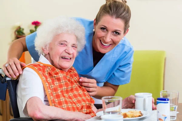 Nurse Senior Woman Helping Meal Stock Picture