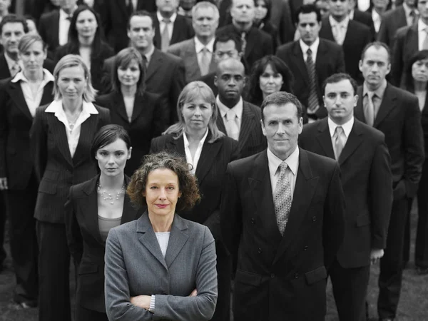 stock image Businesswoman leading a large team of professionals