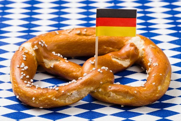 Single Bavarian Pretzel German Flag Blue White Rhombus Napkin — Stock Photo, Image