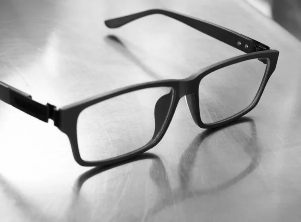 Black White Photo Plastic Frame Glasses Steel Table — Stock Photo, Image