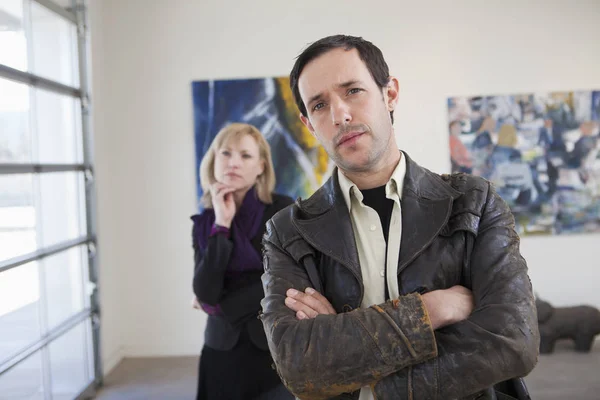 People looking at art in art gallery