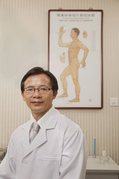 Chinese doctor smiling in office