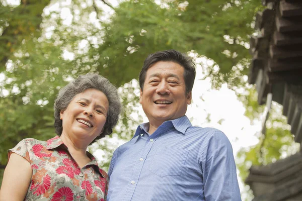 Older Chinese couple smiling