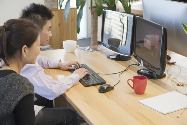 Chinese business people working at desk