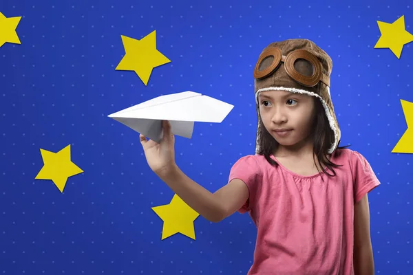 Cheerful Asian Kid Aviator Hat Playing Paper Planes Blue Wall — Stock Photo, Image