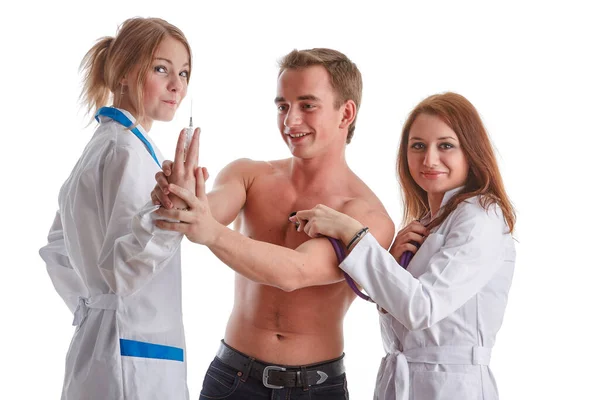 Two Nurses Young Male Patient White Background Vaccination — Stock Photo, Image