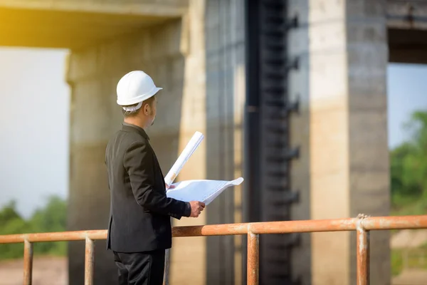 Asian Young Man Engineers Holding Blueprint Looking Floodgates Check Progress — Stock Photo, Image